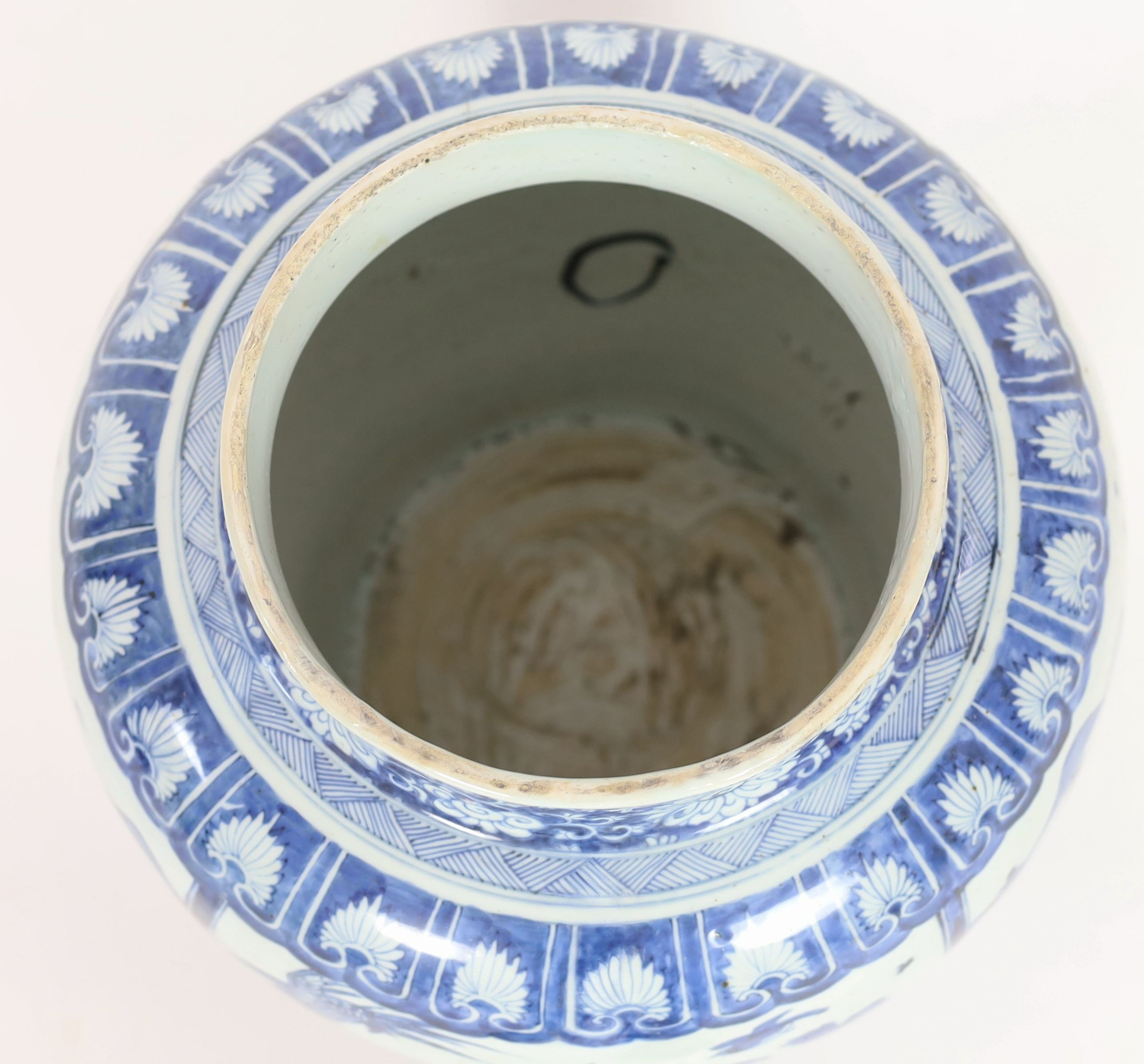 A large Chinese blue and white jar and cover, Kangxi period, 58cm high, Some restored cracks